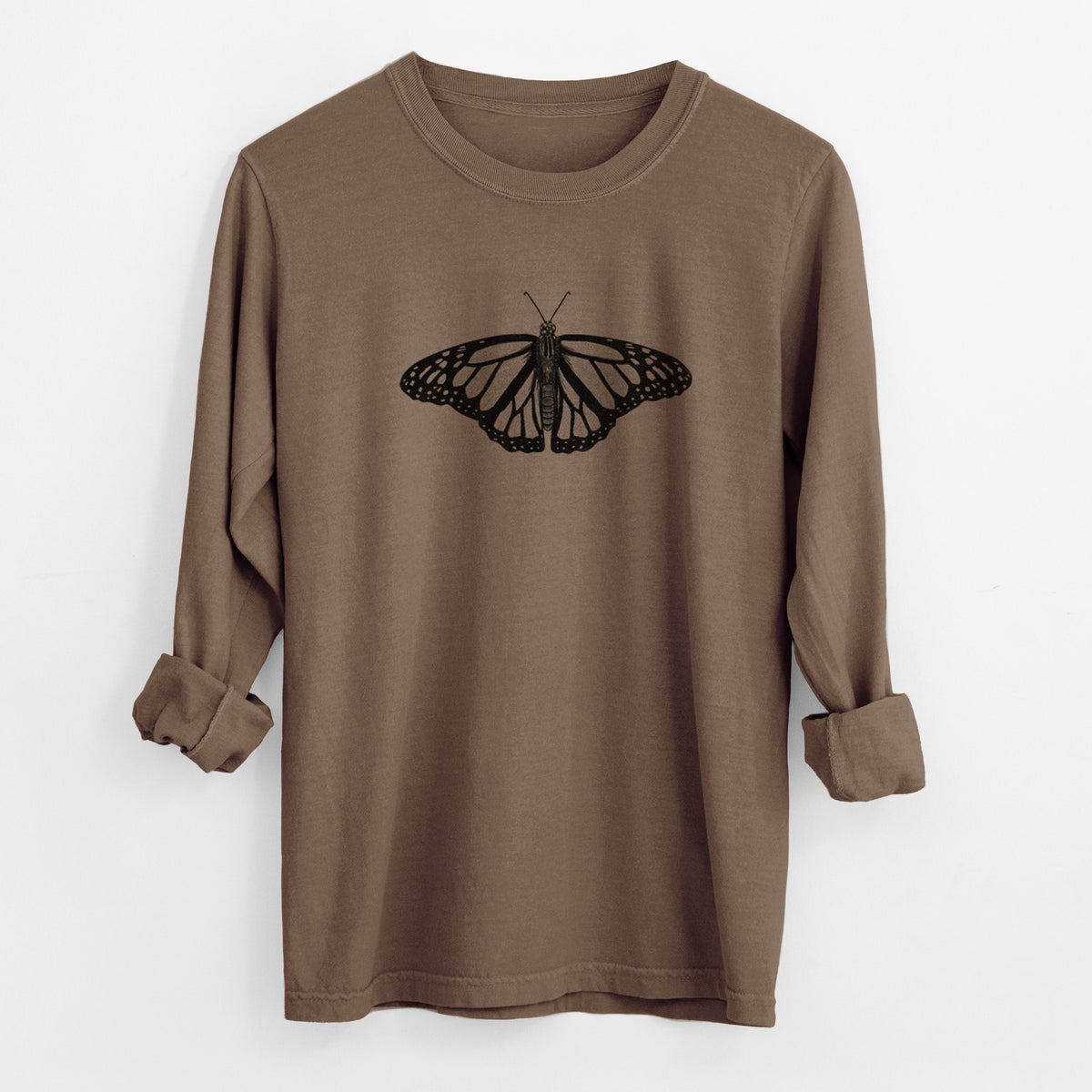 Espresso brown Comfort Colors long sleeve shirt laid flat with the cuffs rolled, printed with a detailed black ink illustration of a monarch butterfly with its wings spread.