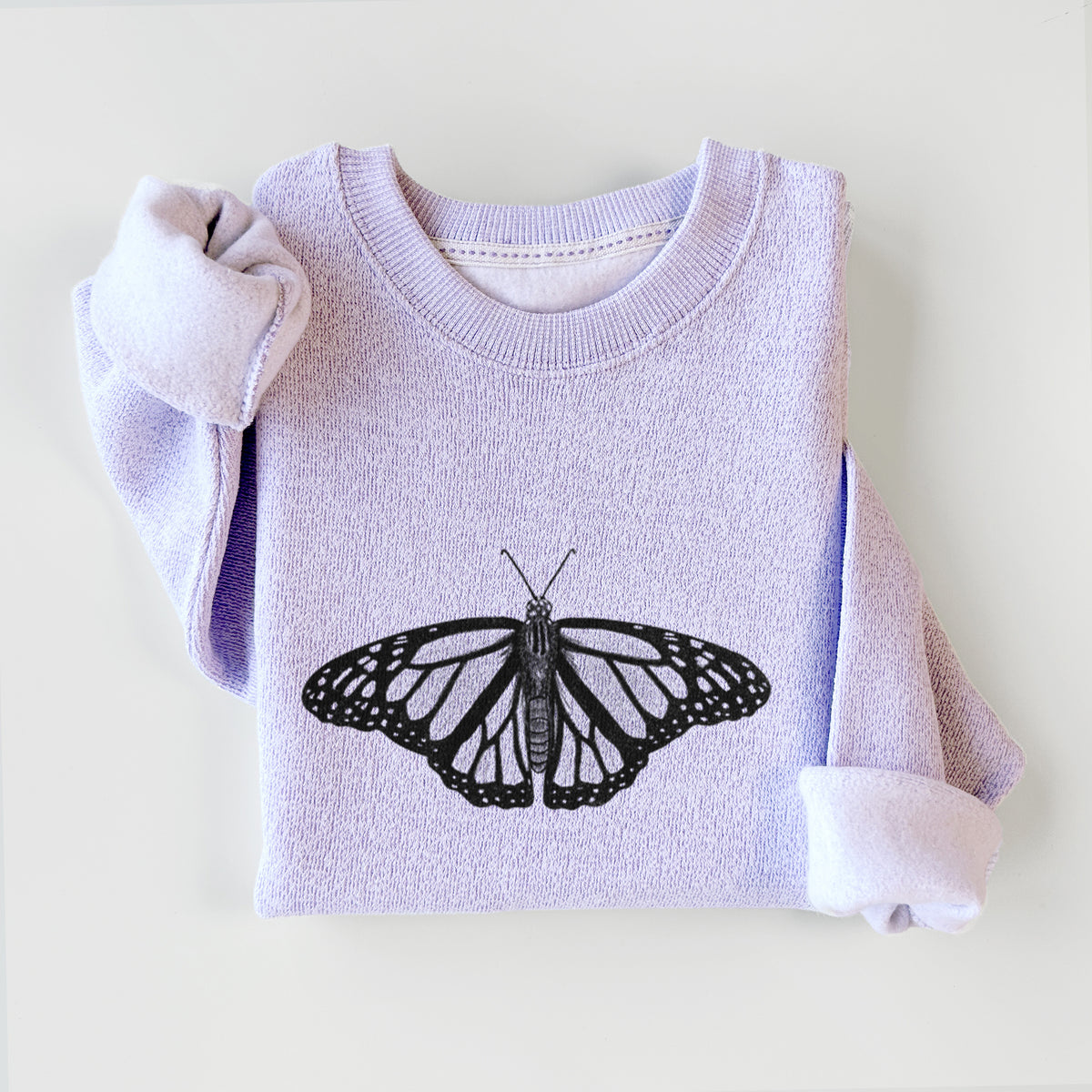 Ice purple knit sweatshirt printed with a detailed black ink illustration of a monarch butterfly with its wings spread, styled flat.