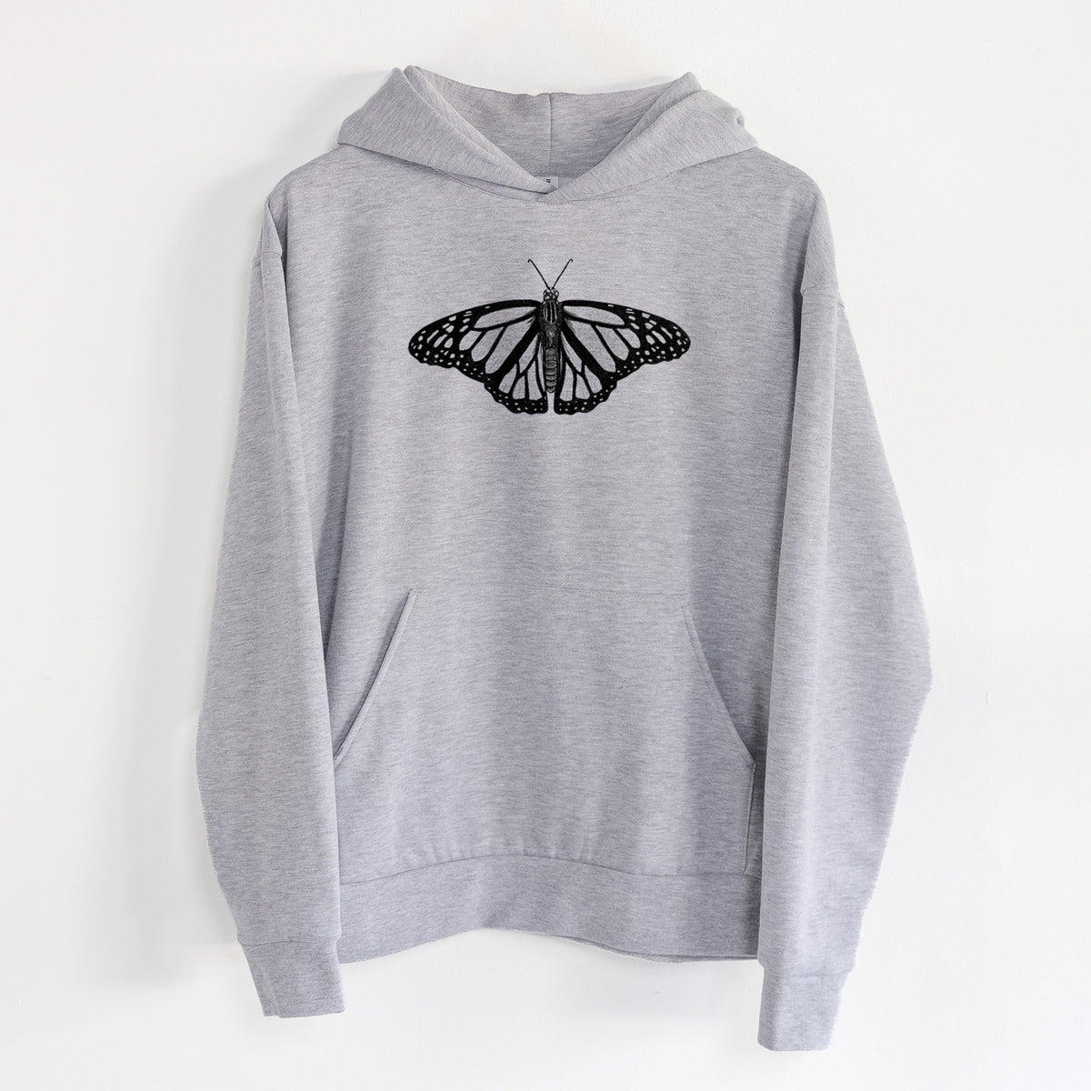 Danaus plexippus - Monarch Butterfly - Statement Midweight Hoodie in Heather Grey, hanging on a white wall, with a front kangaroo pocket and no drawcords.