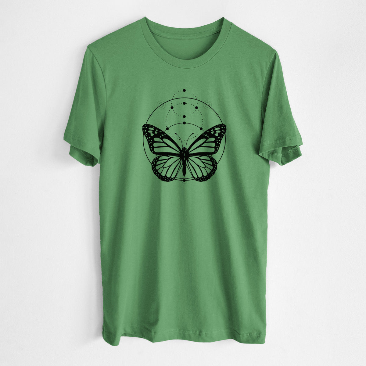 Leaf green lightweight cotton t-shirt laid flat, printed with a black ink monarch butterfly inside a circle, beneath a line of moon phases.