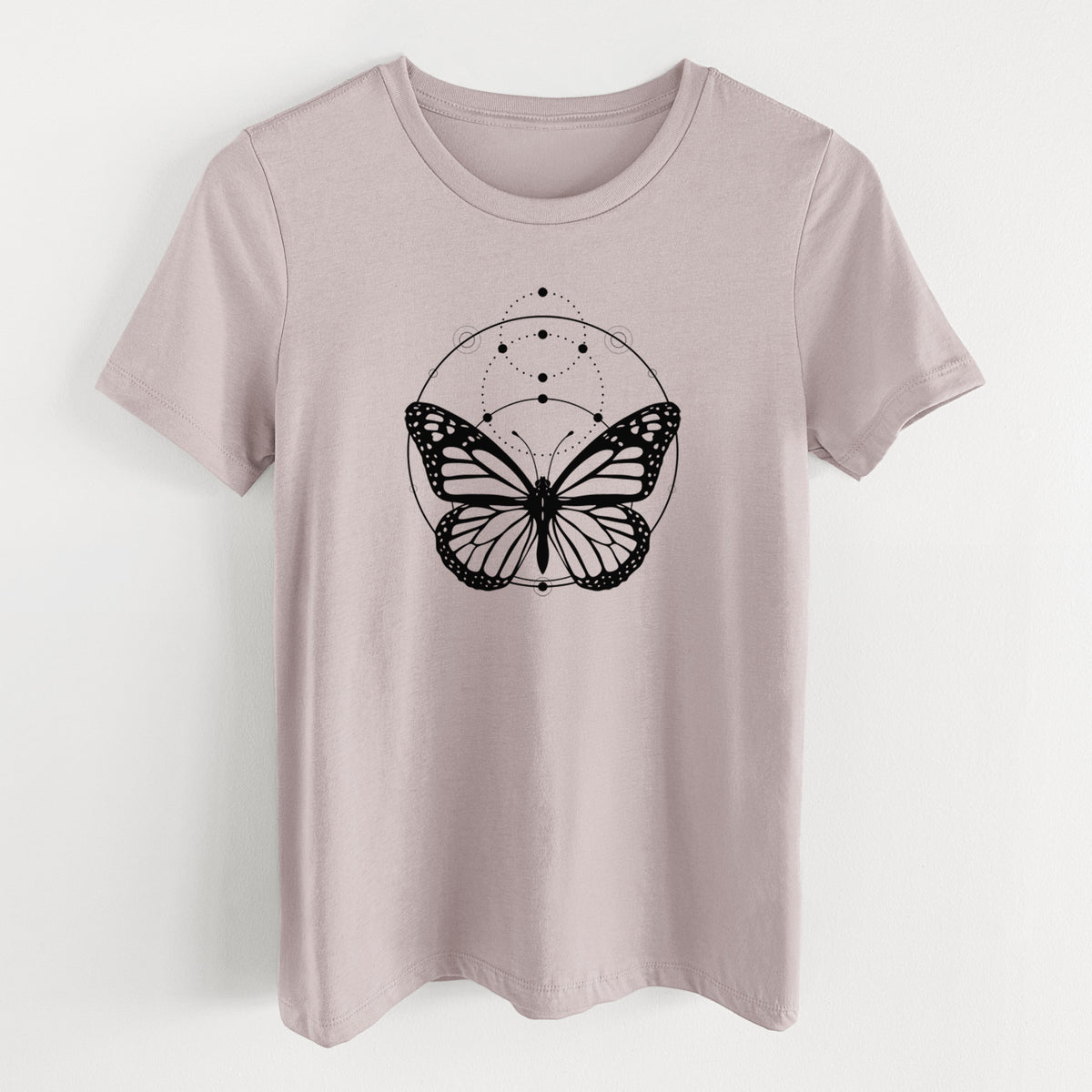Pink gravel women's relaxed fit cotton t-shirt laid flat, printed with a black ink monarch butterfly inside a circle, beneath a line of moon phases.