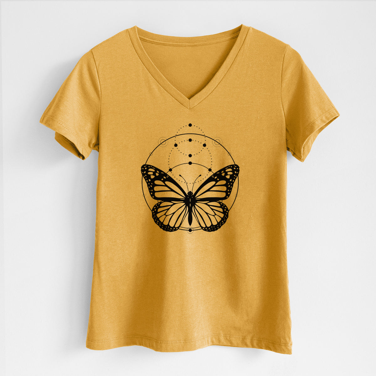 Honeycomb yellow women's relaxed fit cotton V-neck t-shirt laid flat, printed with a black ink monarch butterfly inside a circle, beneath a line of moon phases.