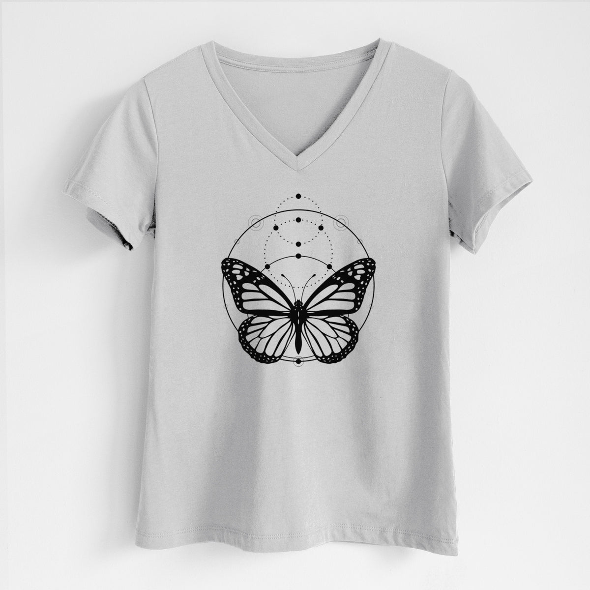 Lunar grey women's relaxed fit cotton V-neck t-shirt laid flat, printed with a black ink monarch butterfly inside a circle, beneath a line of moon phases.