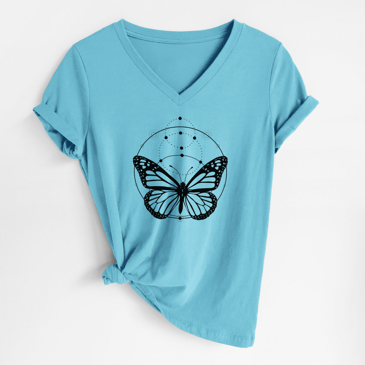 Turquoise women's relaxed fit cotton V-neck t-shirt laid flat, printed with a black ink monarch butterfly inside a circle, beneath a line of moon phases.