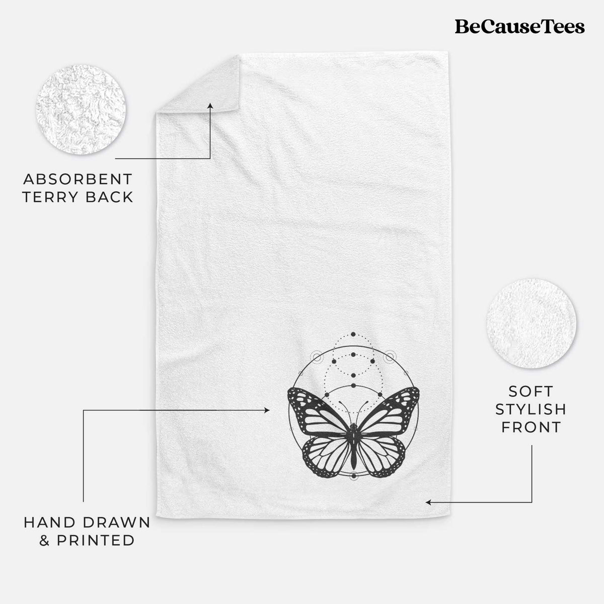 White hand towel printed with a black ink monarch butterfly inside a circle, beneath a line of moon phases.