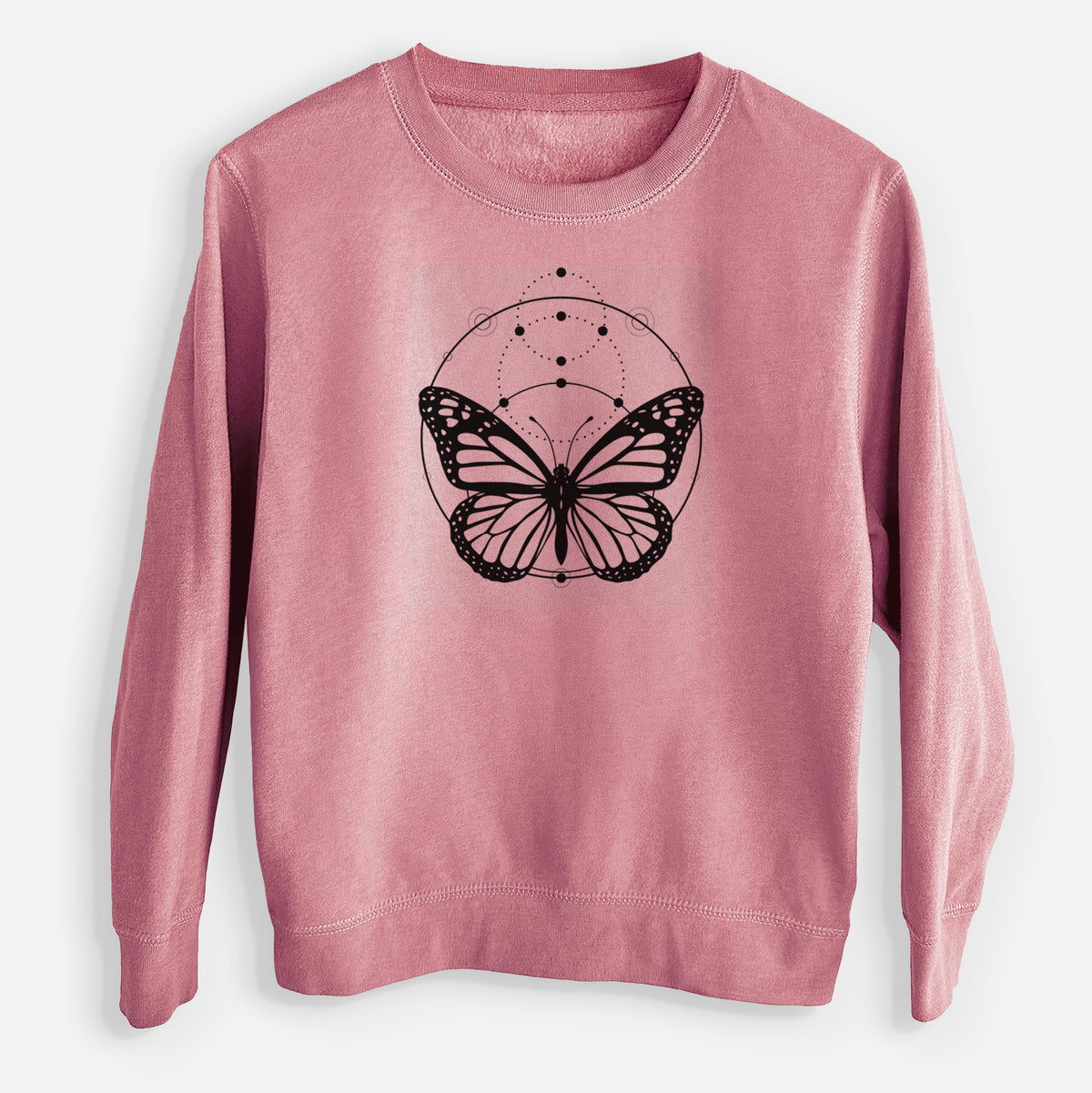Mauve pink youth crewneck sweatshirt laid flat, printed with a black ink monarch butterfly inside a circle, beneath a line of moon phases.