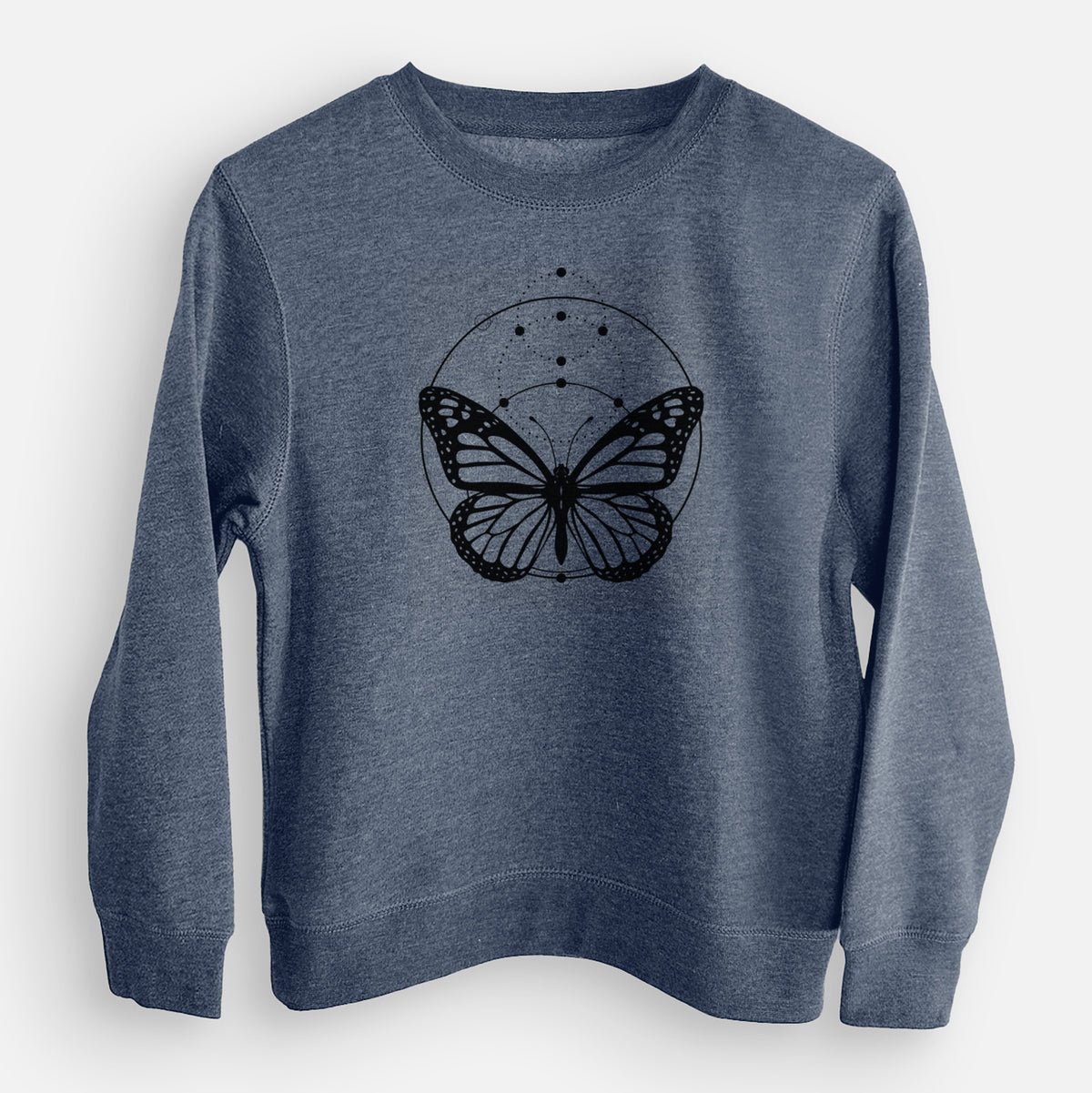 Storm blue youth crewneck sweatshirt laid flat, printed with a black ink monarch butterfly inside a circle, beneath a line of moon phases.