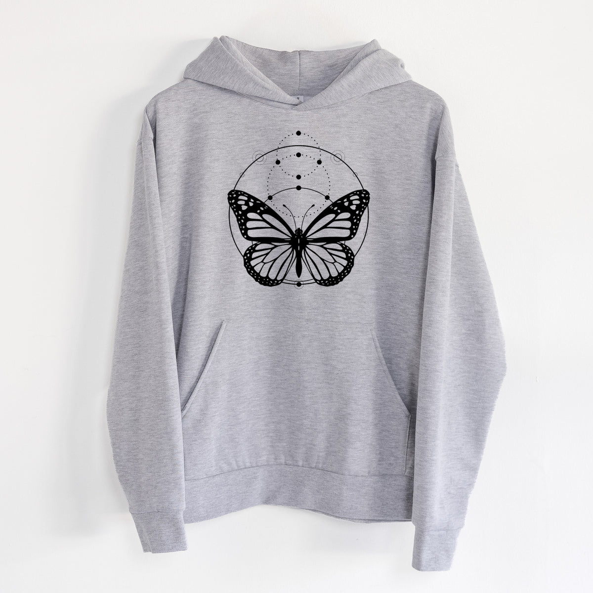 Monarch Symmetry - Statement Midweight Hoodie in Heather Grey, hanging on a white wall, with a front kangaroo pocket and no drawcords.