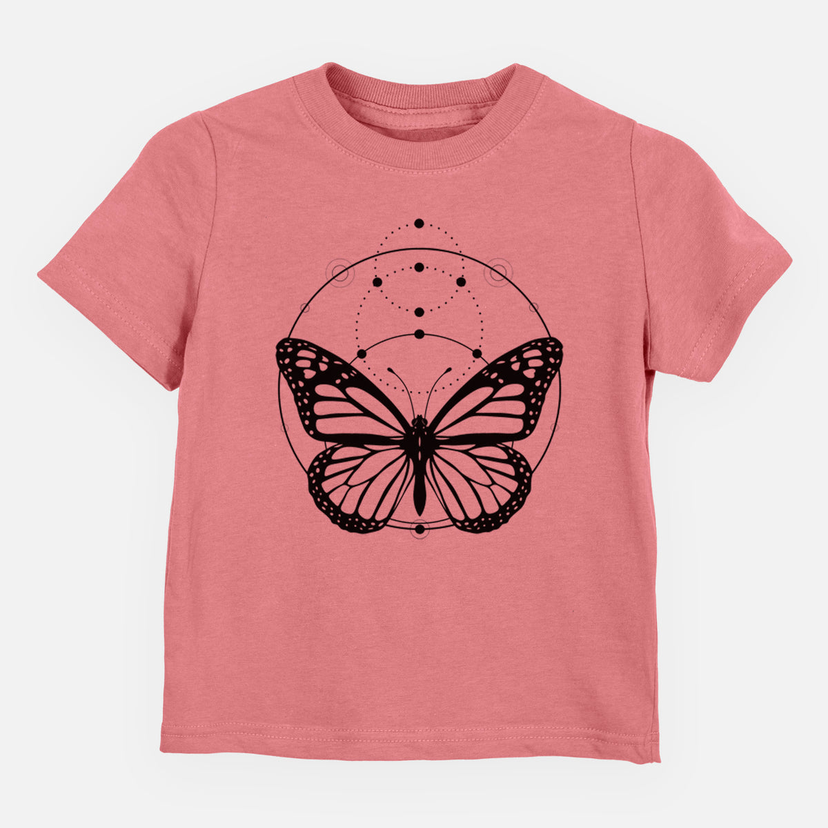 Mauve pink toddler t-shirt laid flat, printed with a black ink monarch butterfly inside a circle, beneath a line of moon phases.