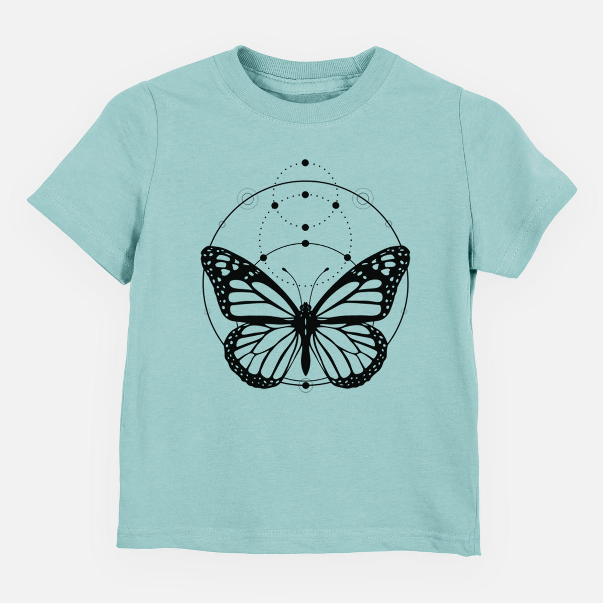 Saltwater toddler t-shirt laid flat, printed with a black ink monarch butterfly inside a circle, beneath a line of moon phases.