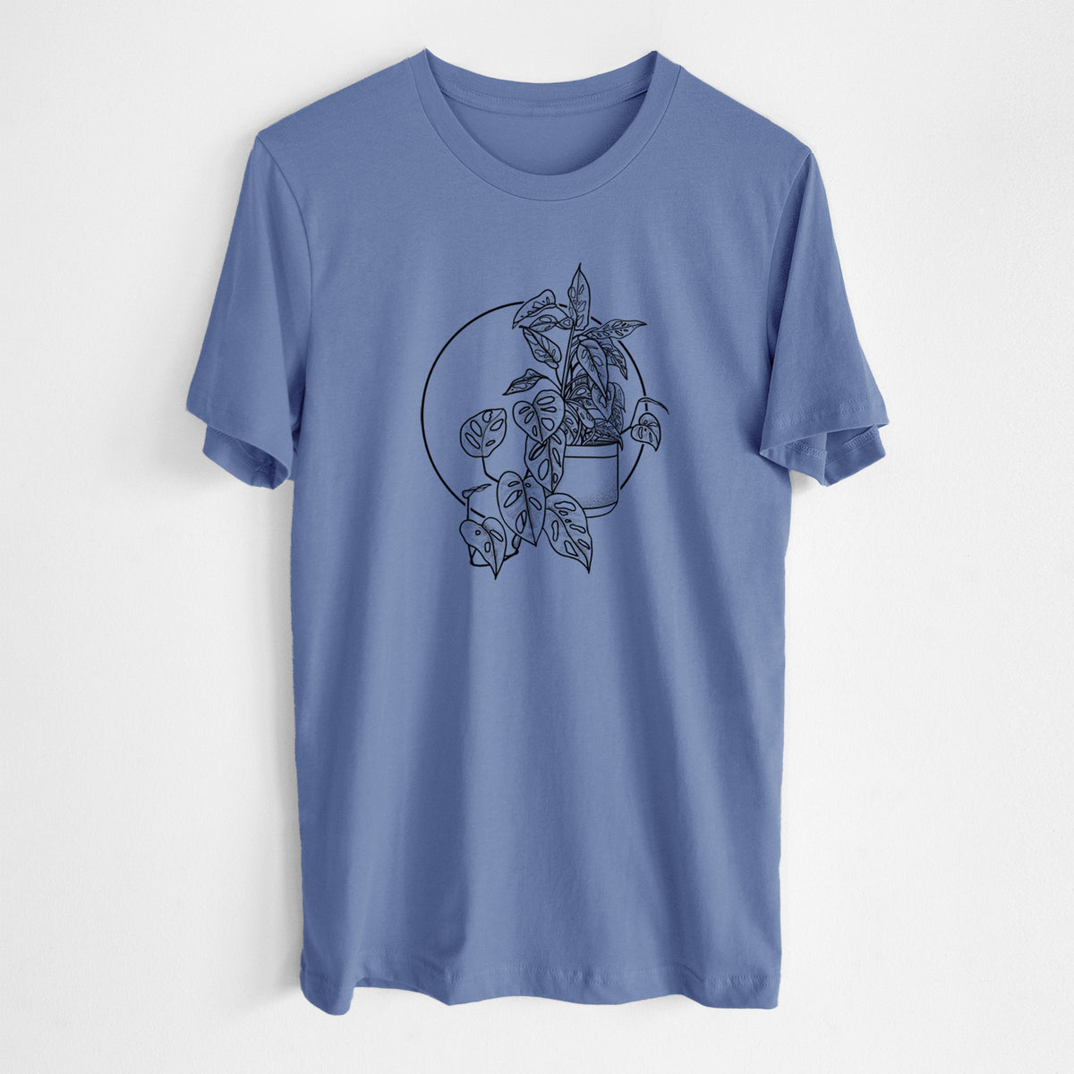 Blue bell lightweight cotton t-shirt laid flat, printed with a black ink illustration of a potted Monsteradansonii plant with trailing vines in front of a circle.