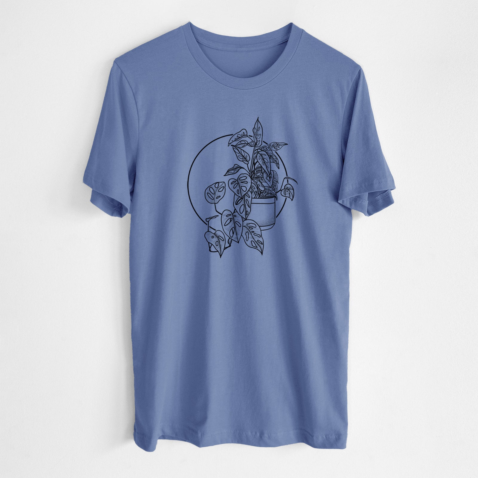 Blue bell lightweight cotton t-shirt laid flat, printed with a black ink illustration of a potted Monsteradansonii plant with trailing vines in front of a circle.