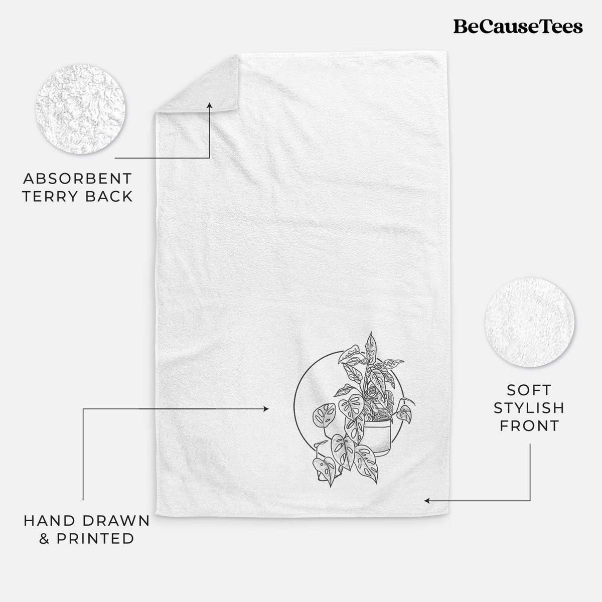 White hand towel printed with a black ink illustration of a potted Monsteradansonii plant with trailing vines in front of a circle.
