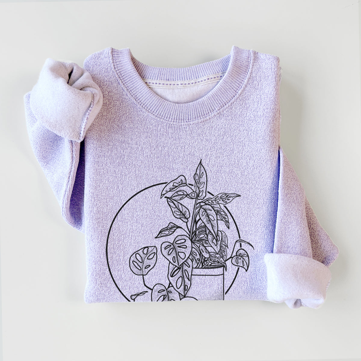 Ice purple knit sweatshirt printed with a black ink illustration of a potted Monsteradansonii plant with trailing vines in front of a circle, styled flat.
