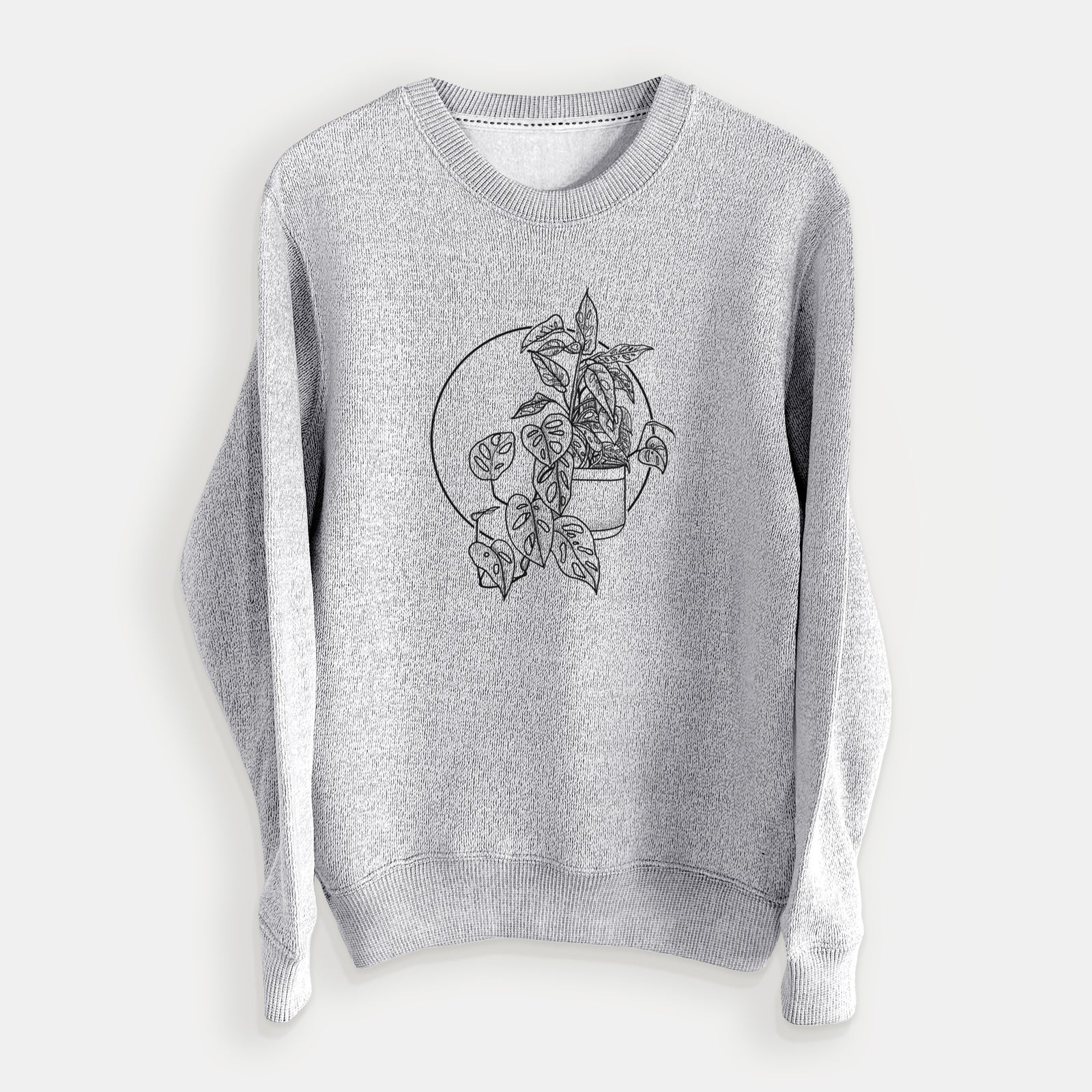 Salt and pepper knit sweatshirt laid flat, printed with a black ink illustration of a potted Monsteradansonii plant with trailing vines in front of a circle.