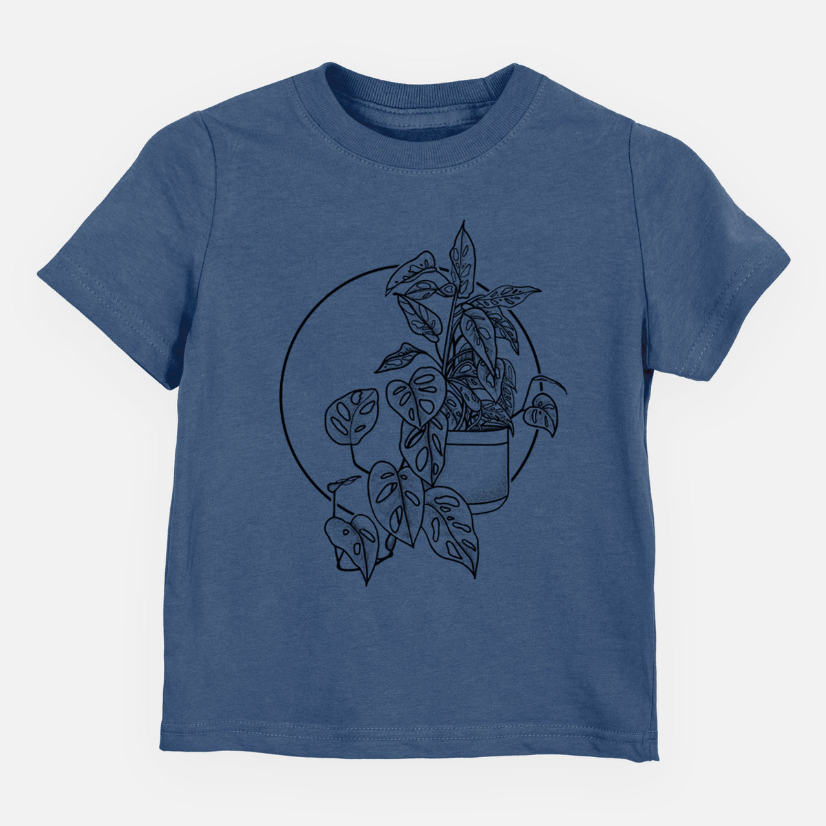 Indigo blue toddler t-shirt laid flat, printed with a black ink illustration of a potted Monsteradansonii plant with trailing vines in front of a circle.
