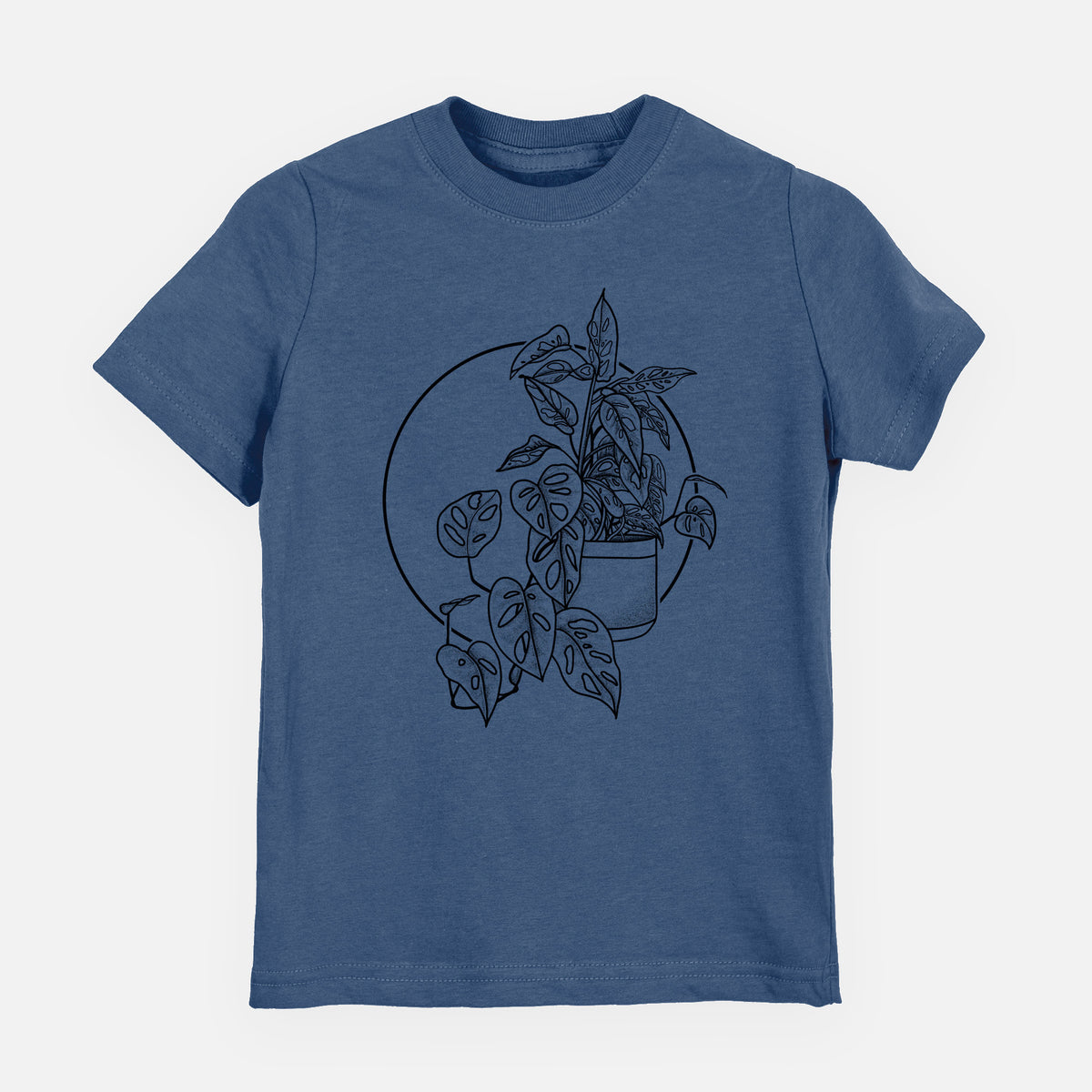Indigo blue youth t-shirt laid flat, printed with a black ink illustration of a potted Monsteradansonii plant with trailing vines in front of a circle.