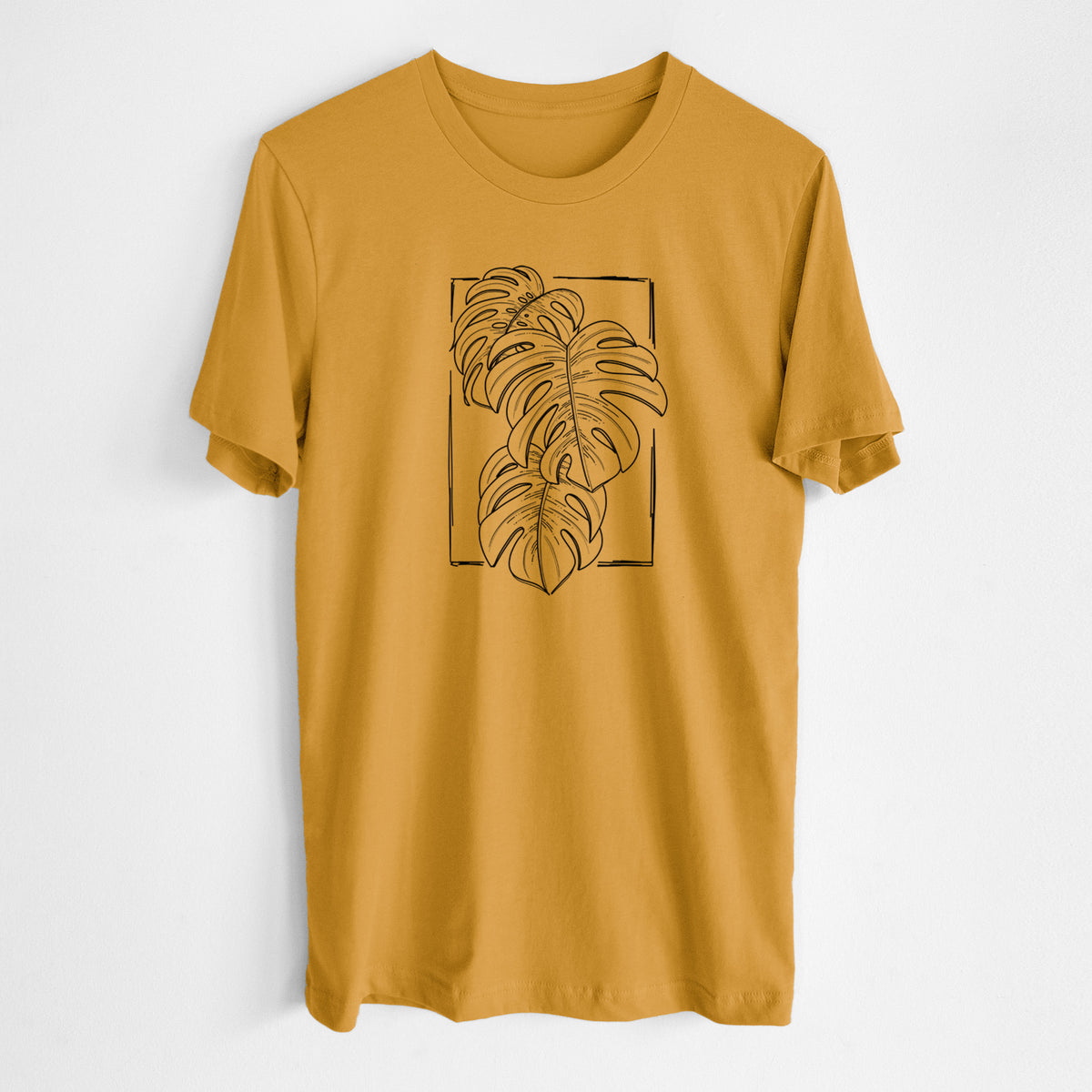 Honeycomb yellow lightweight cotton t-shirt laid flat, printed with a black ink line drawing of Monstera deliciosa leaves inside a rectangle outline.
