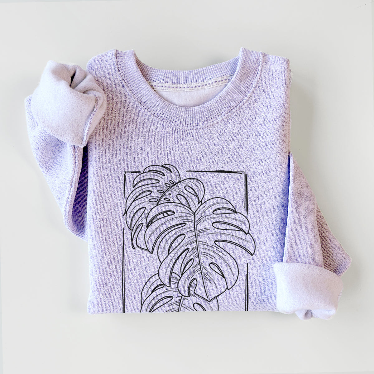 Ice purple knit sweatshirt printed with a black ink line drawing of Monstera deliciosa leaves inside a rectangle outline, styled flat.