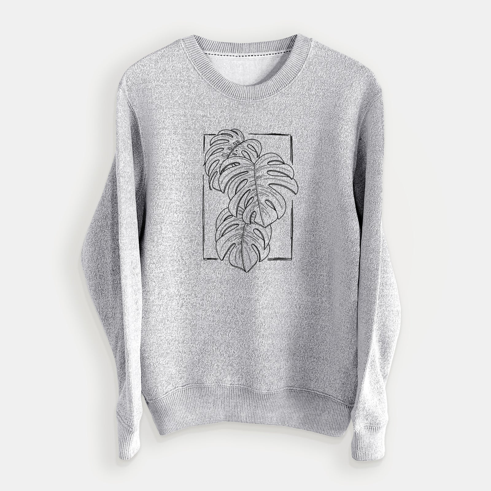 Salt and pepper knit sweatshirt laid flat, printed with a black ink line drawing of Monstera deliciosa leaves inside a rectangle outline.