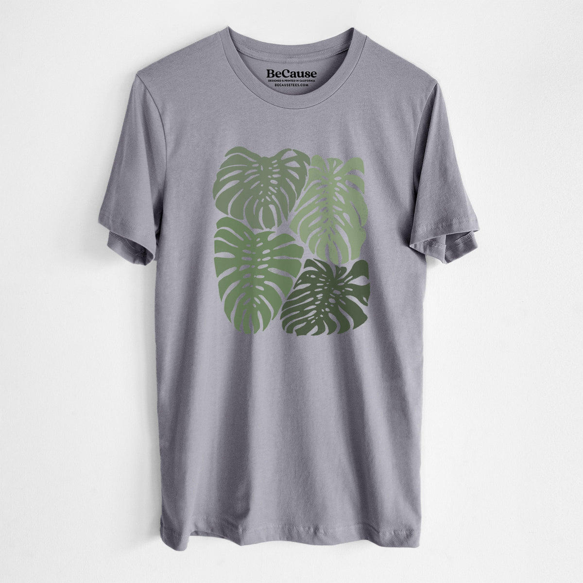 Storm grey lightweight cotton t-shirt laid flat, printed with a full-color illustration of large green Monstera leaves filling a square.