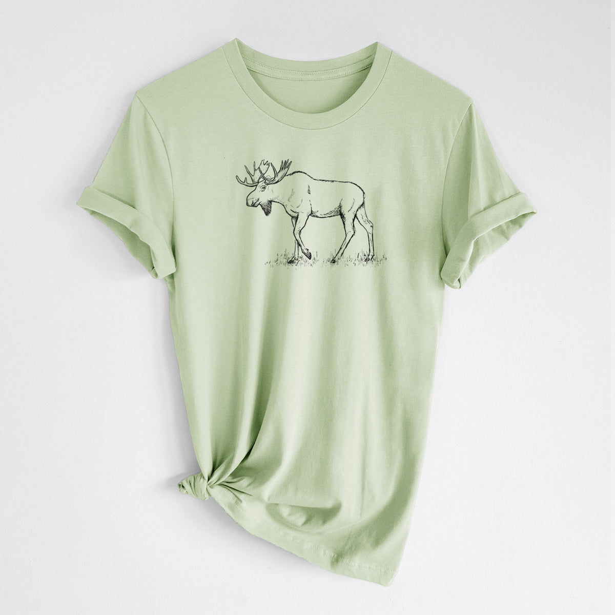Spring green lightweight cotton t-shirt laid flat with the sleeves rolled, printed with a black ink illustration of a bull moose with broad antlers walking.