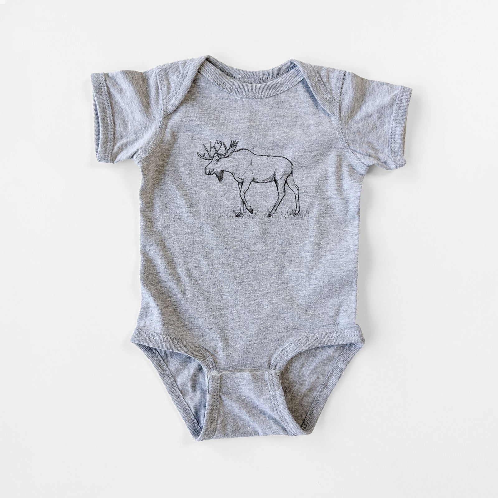 Grey baby bodysuit laid flat, printed with a black ink illustration of a bull moose with broad antlers walking.
