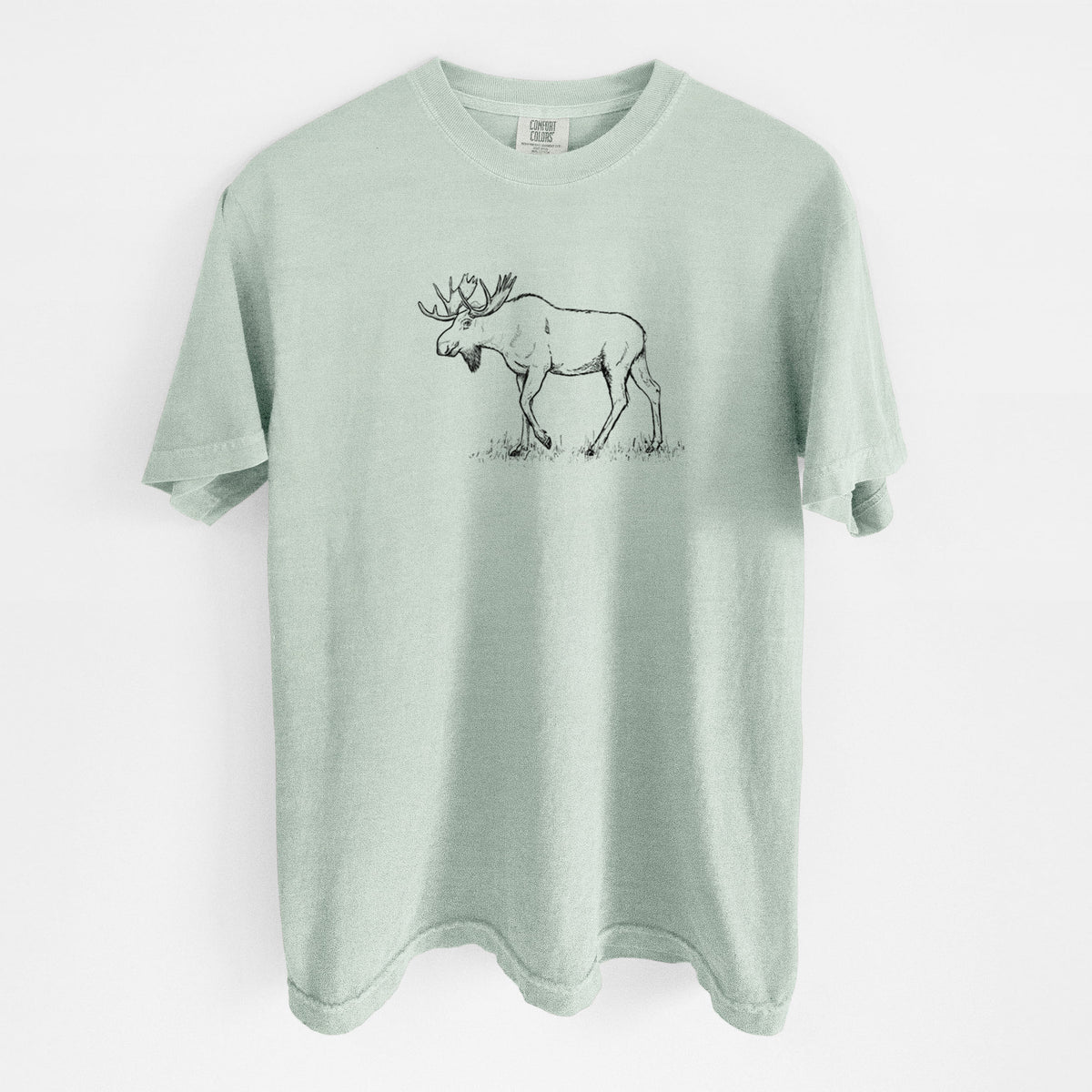 Bay green Comfort Colors t-shirt laid flat, printed with a black ink illustration of a bull moose with broad antlers walking.