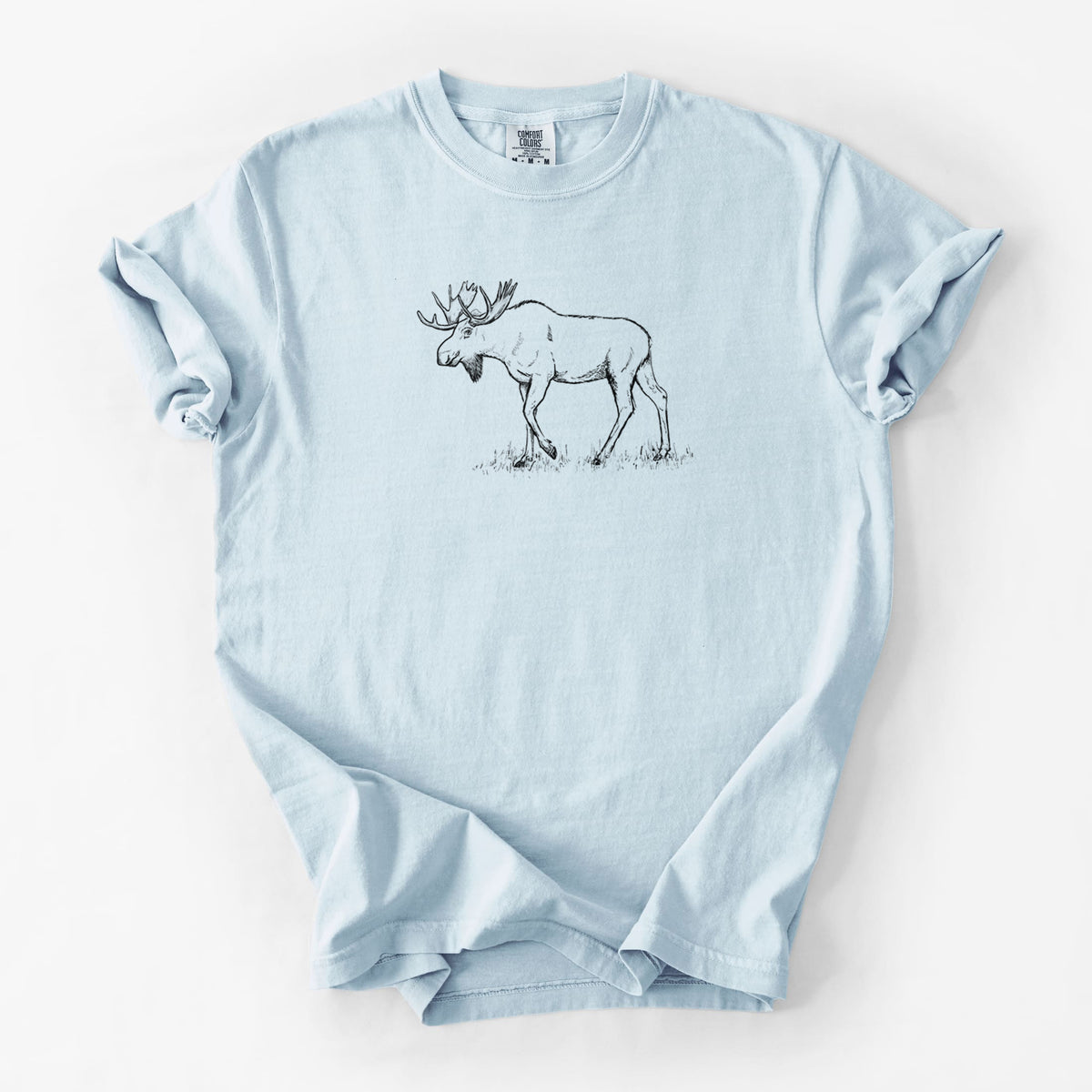 Chambray blue Comfort Colors t-shirt laid flat, printed with a black ink illustration of a bull moose with broad antlers walking.