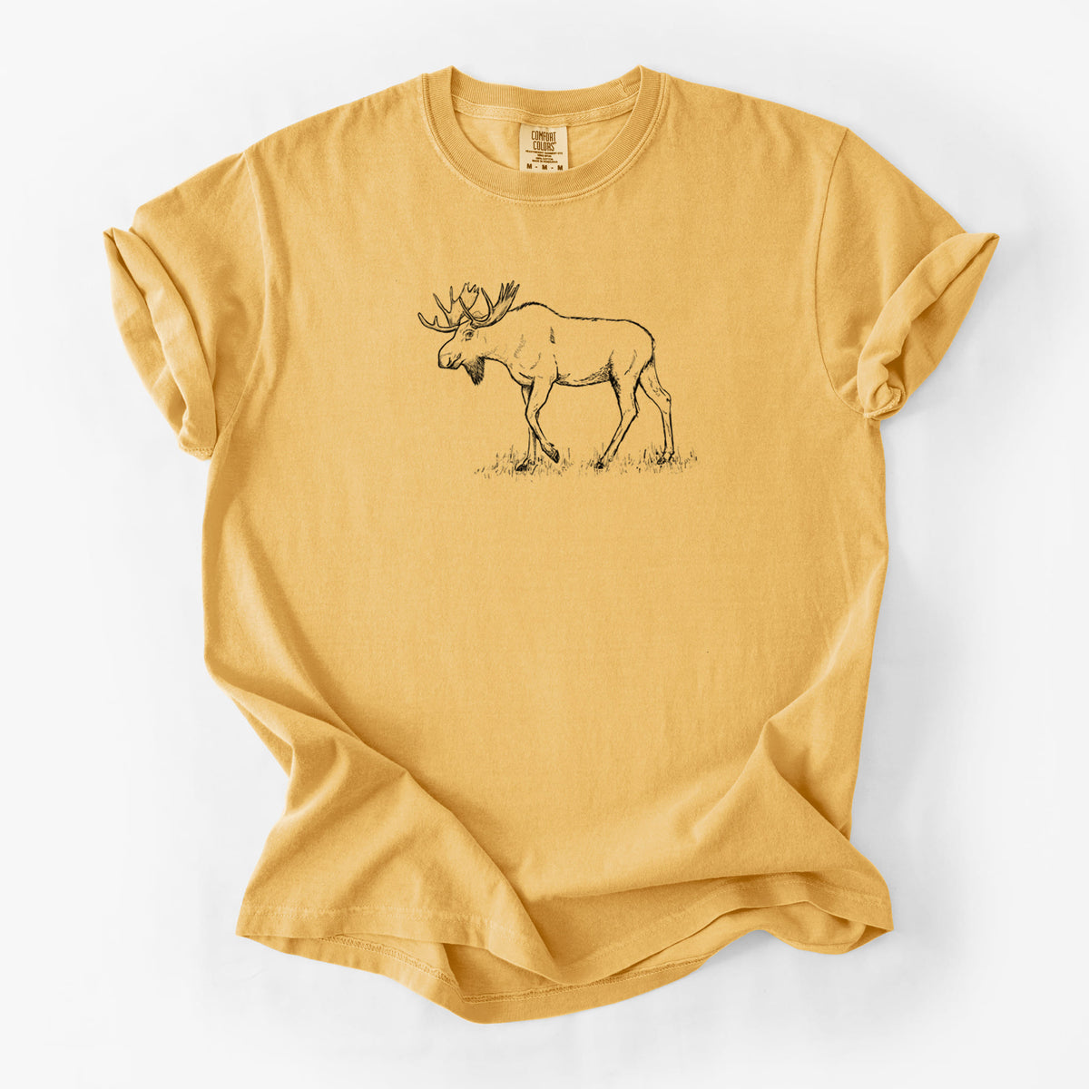Golden wheat yellow Comfort Colors t-shirt laid flat, printed with a black ink illustration of a bull moose with broad antlers walking.