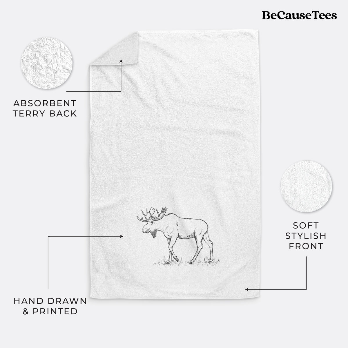 White hand towel printed with a black ink illustration of a bull moose with broad antlers walking.