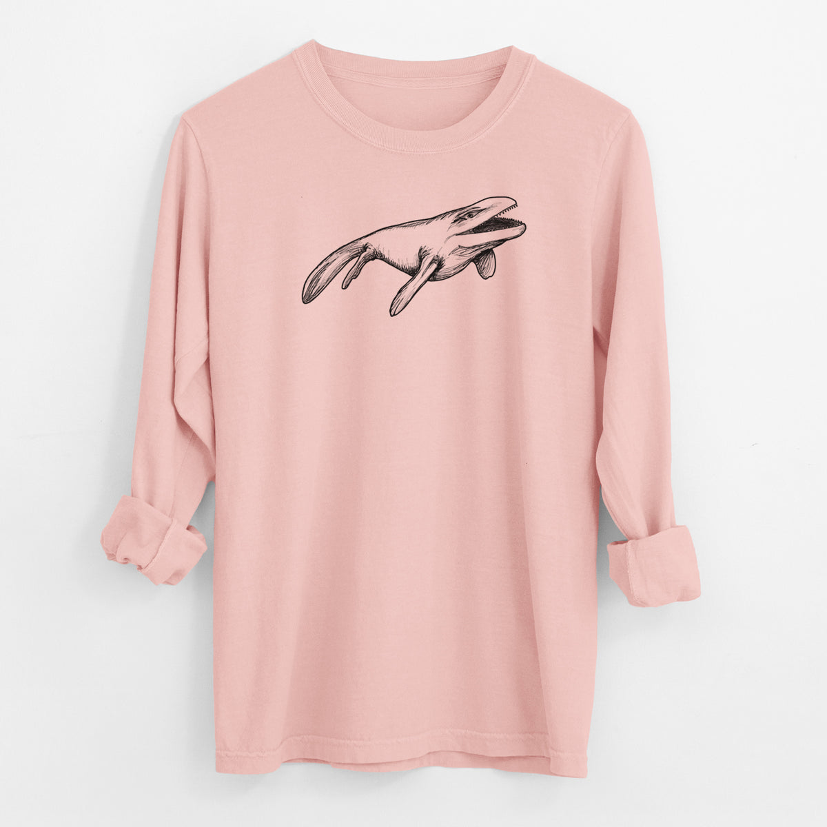 Peachy Comfort Colors long sleeve shirt laid flat with the cuffs rolled, printed with a black ink illustration of a Mosasaur swimming.