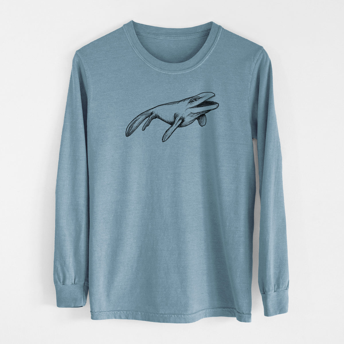 Steel blue Comfort Colors long sleeve shirt laid flat, printed with a black ink illustration of a Mosasaur swimming.