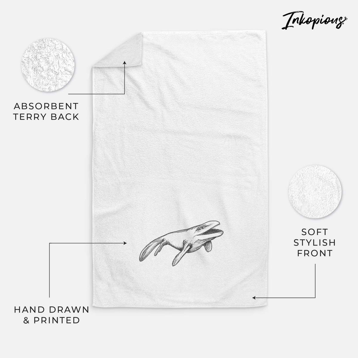 White hand towel printed with a black ink illustration of a Mosasaur swimming.