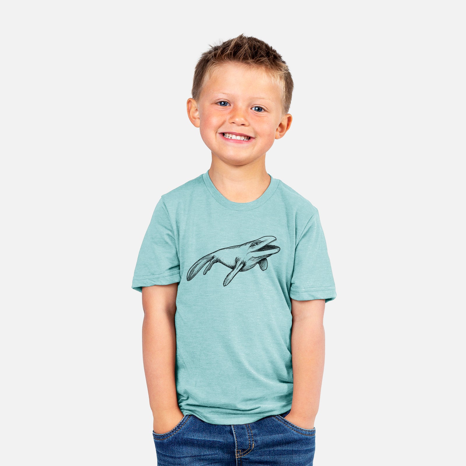 Two youth t-shirts in different colors on hangers, printed with a black ink illustration of a Mosasaur swimming.