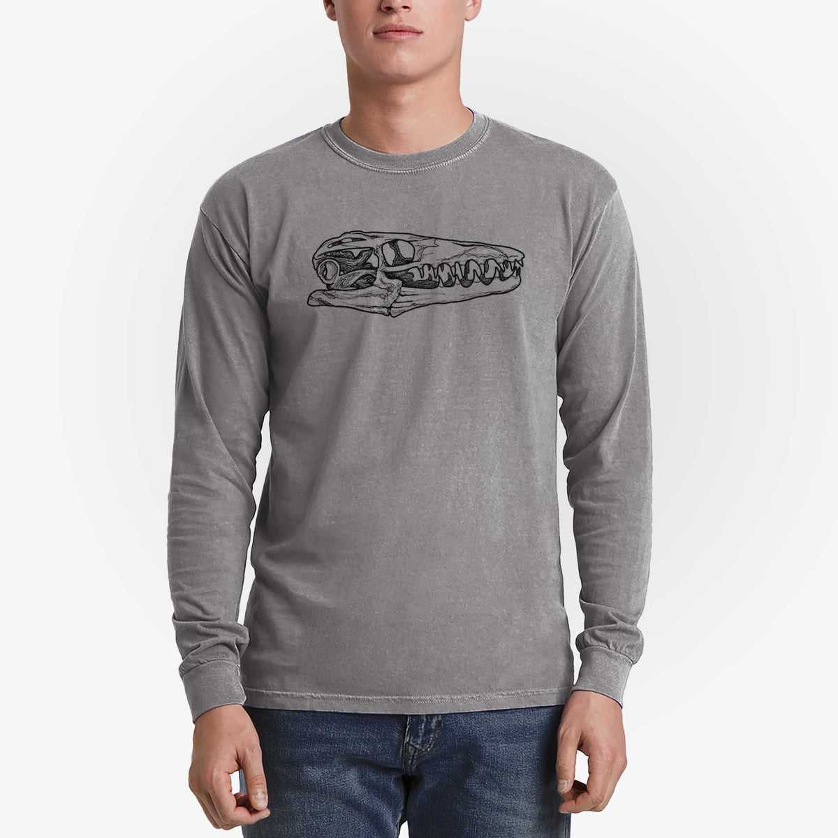 Man wearing a grey Comfort Colors long sleeve shirt printed with a detailed black ink illustration of a Mosasaur skull.