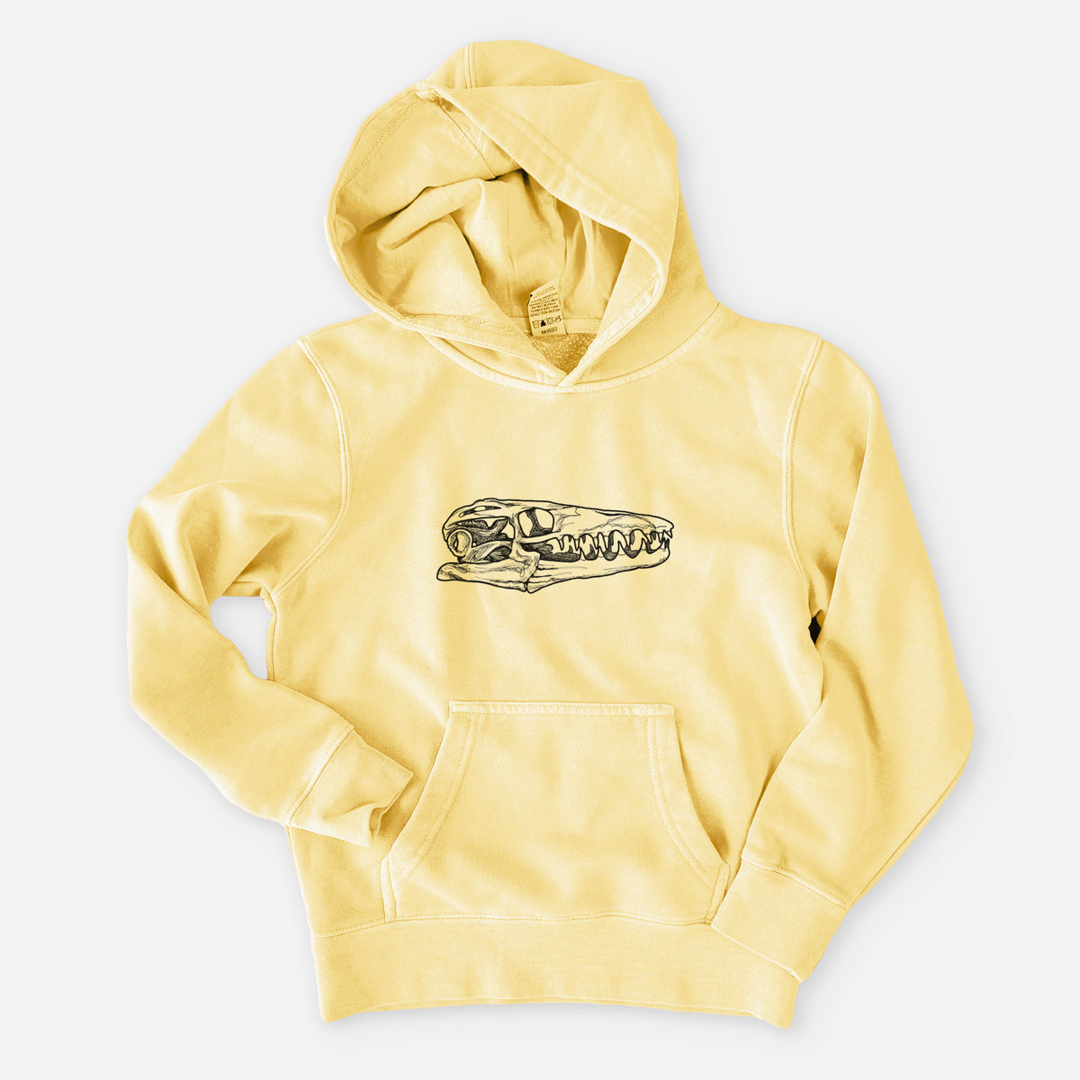 Pigment yellow youth pigment dyed hoodie laid flat, printed with a detailed black ink illustration of a Mosasaur skull.
