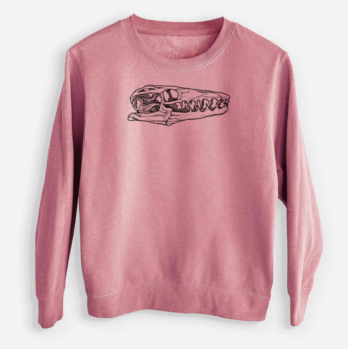 Mauve pink youth crewneck sweatshirt laid flat, printed with a detailed black ink illustration of a Mosasaur skull.