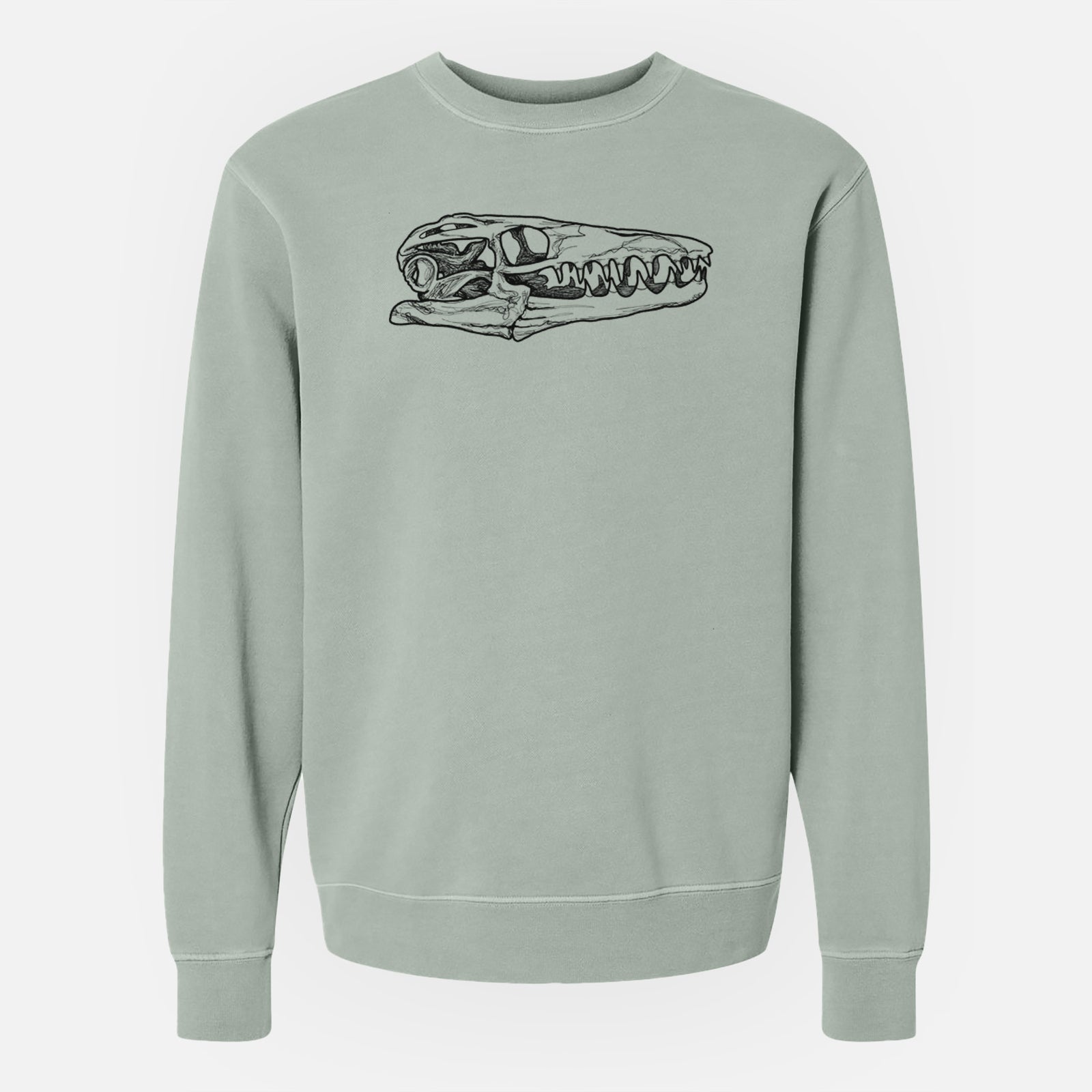 Sage green pigment dyed crewneck sweatshirt laid flat, printed with a detailed black ink illustration of a Mosasaur skull.