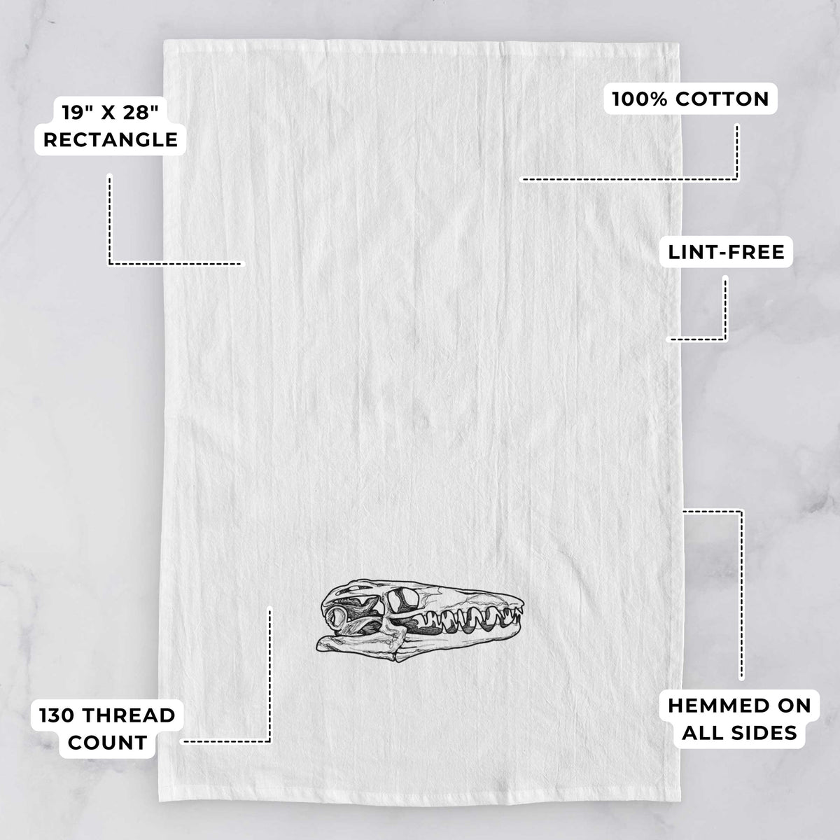 White tea towel printed with a detailed black ink illustration of a Mosasaur skull, with feature labels: 19 by 28 inch rectangle, 100% cotton, lint-free, 130 thread count, hemmed on all sides.