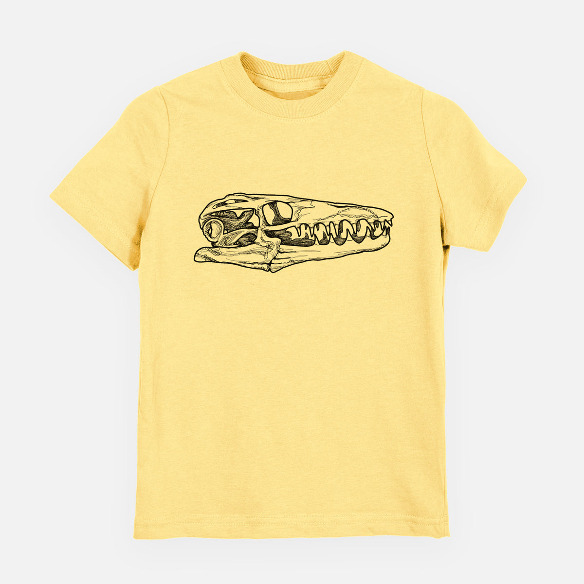 Butter yellow youth t-shirt laid flat, printed with a detailed black ink illustration of a Mosasaur skull.
