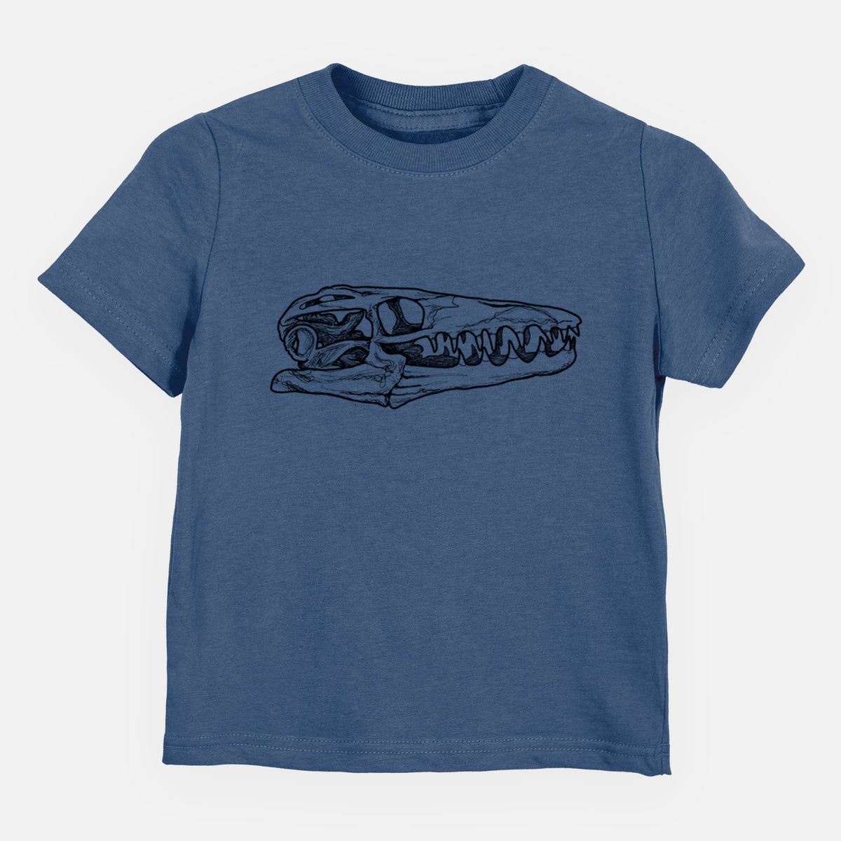 Indigo blue toddler t-shirt laid flat, printed with a detailed black ink illustration of a Mosasaur skull.