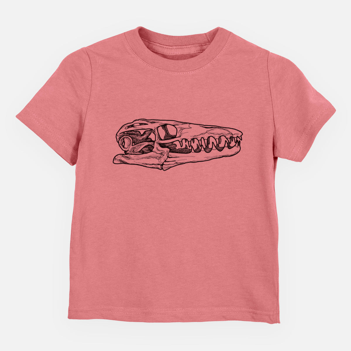Mauve pink toddler t-shirt laid flat, printed with a detailed black ink illustration of a Mosasaur skull.