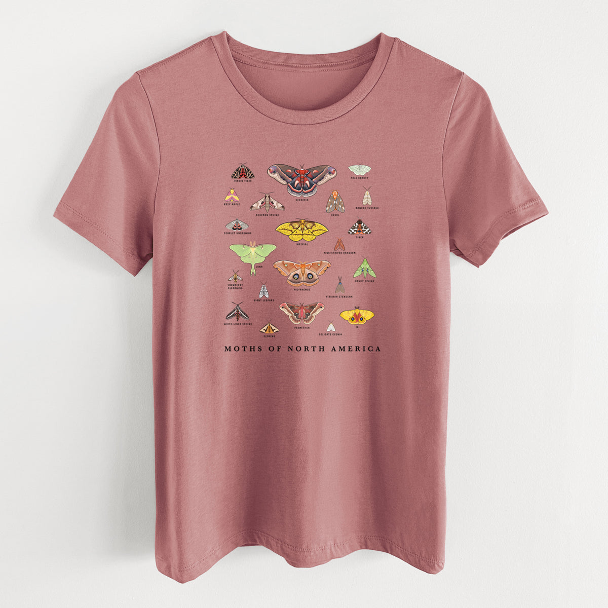 Mauve pink women's relaxed fit cotton t-shirt laid flat, printed with a full-color chart of North American moths, each labeled with its species.