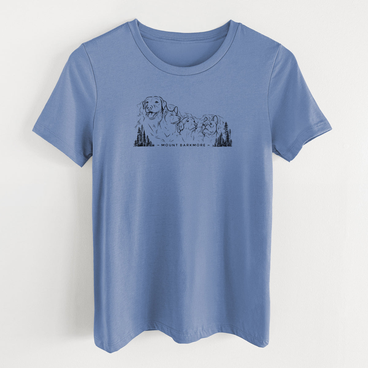 Blue bell women's relaxed fit cotton t-shirt laid flat, printed with a black ink illustration of four dog faces carved into a mountain, with the words Mount Barkmore.