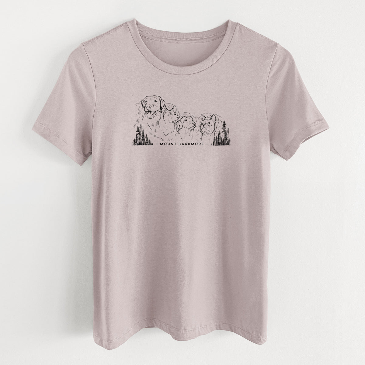 Pink gravel women's relaxed fit cotton t-shirt laid flat, printed with a black ink illustration of four dog faces carved into a mountain, with the words Mount Barkmore.