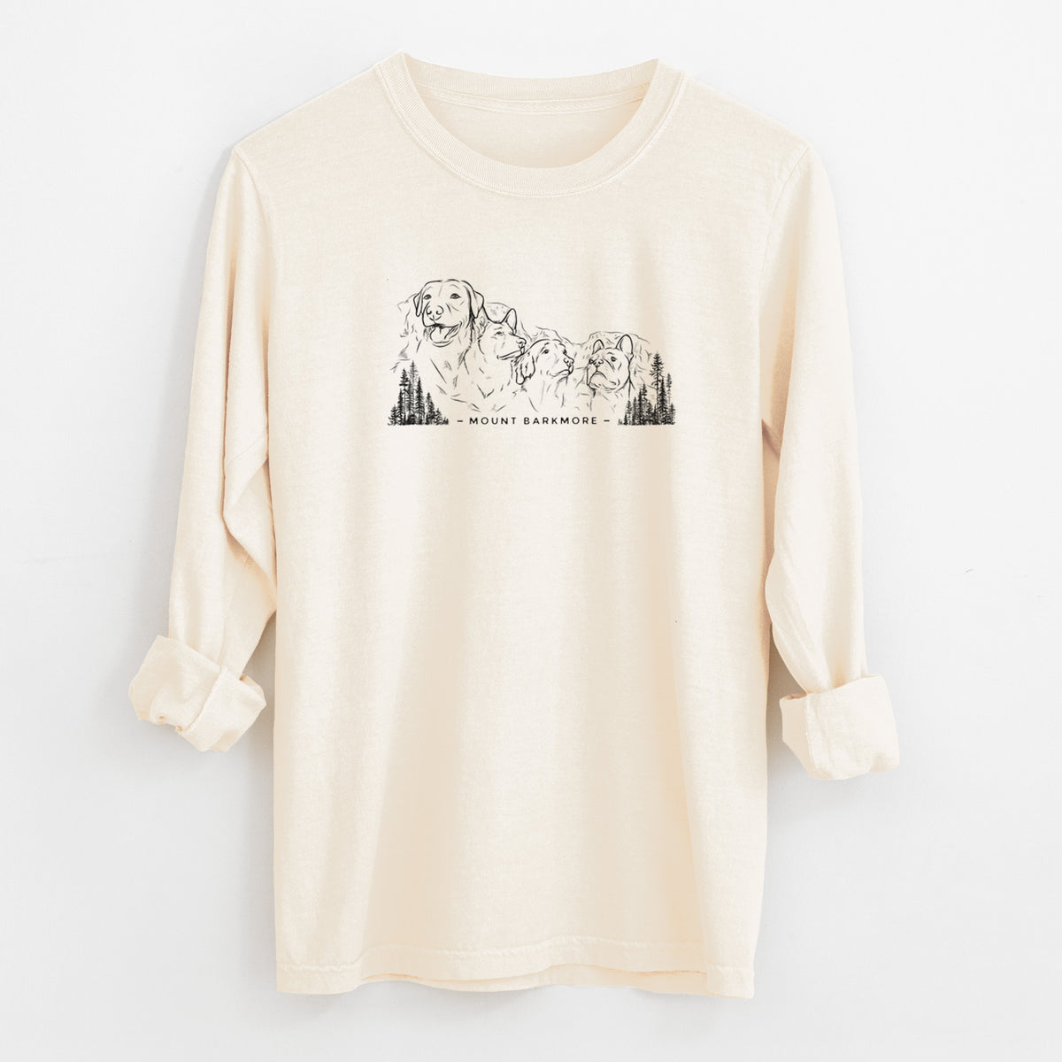 Ivory Comfort Colors long sleeve shirt laid flat with the cuffs rolled, printed with a black ink illustration of four dog faces carved into a mountain, with the words Mount Barkmore.