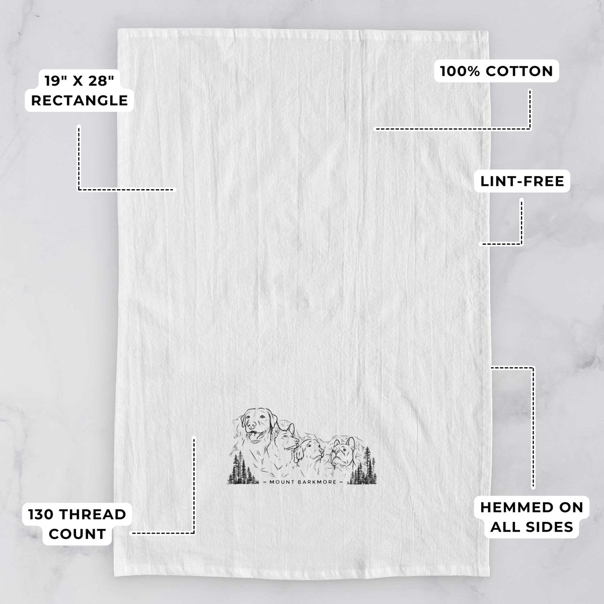 White tea towel printed with a black ink illustration of four dog faces carved into a mountain, with the words Mount Barkmore, with feature labels: 19 by 28 inch rectangle, 100% cotton, lint-free, 130 thread count, hemmed on all sides.