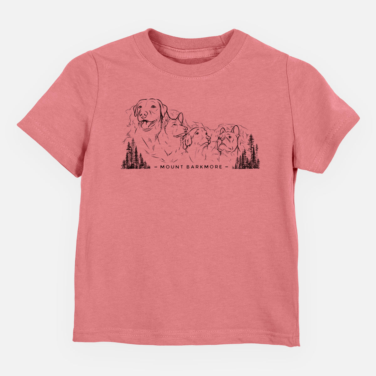 Mauve pink toddler t-shirt laid flat, printed with a black ink illustration of four dog faces carved into a mountain, with the words Mount Barkmore.