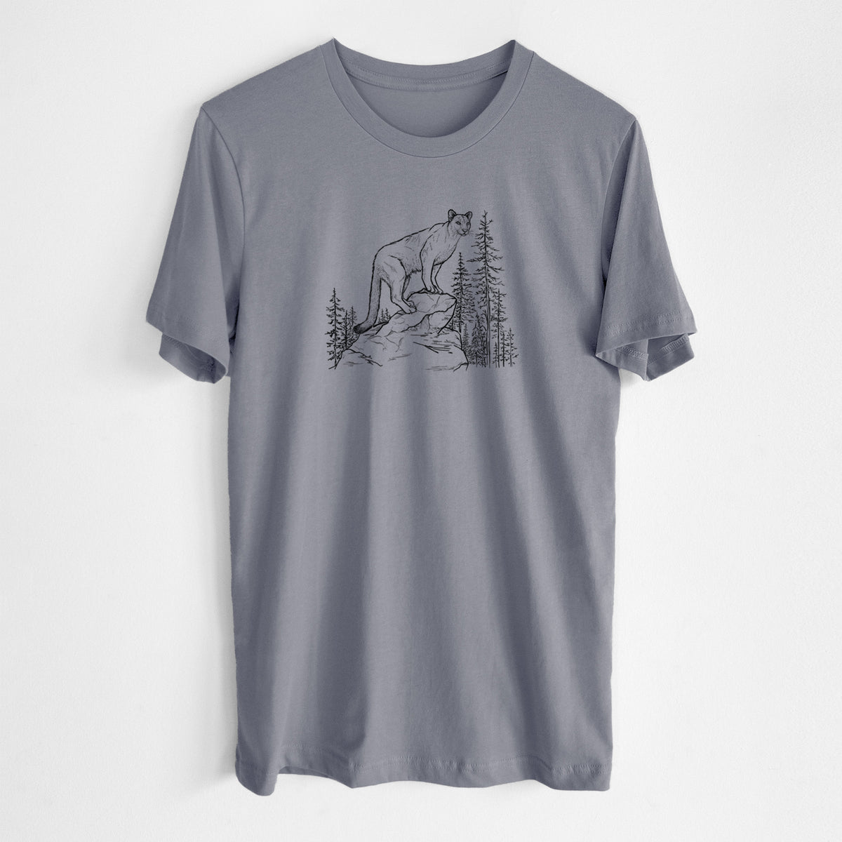 Storm grey lightweight cotton t-shirt laid flat, printed with a black ink illustration of a mountain lion standing on a rocky ledge among pine trees.